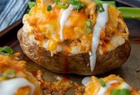 Buffalo Chicken Stuffed Baked Potatoes with Cheesy Topping