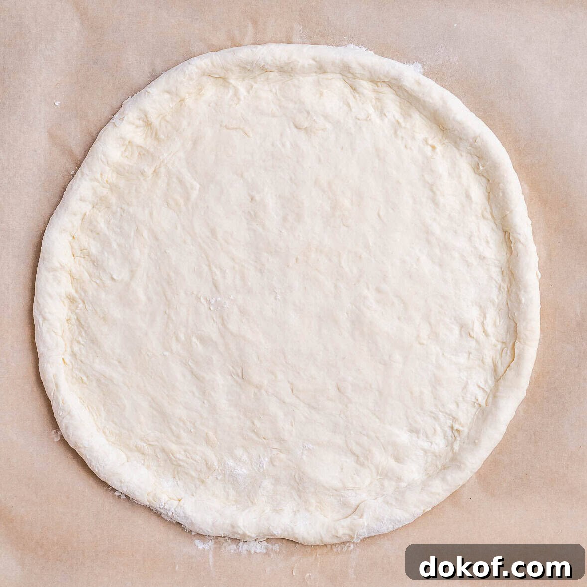 High-Protein White Pizza Recipe for Muscle Building 5 dough spread out on a flat surface.