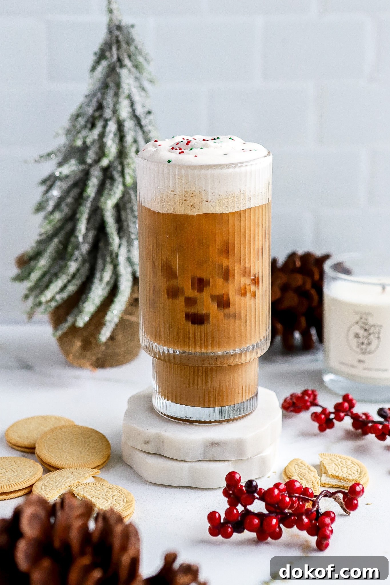 Starbucks-Style Sugar Cookie Cold Foam Recipe — Copycat Guide 3 Side angle of sugar cookie cold foam with Christmas tree in background.