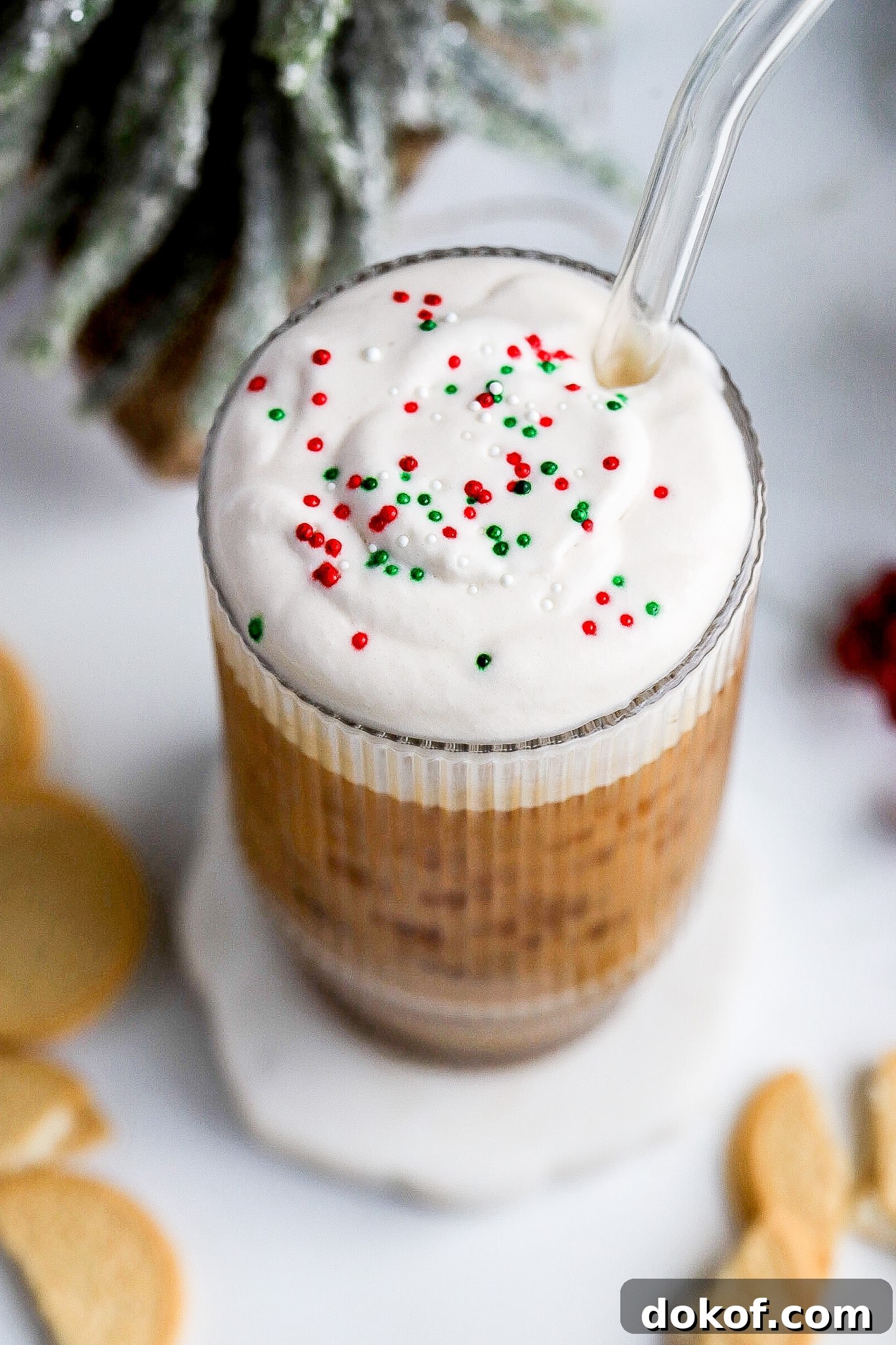 Starbucks-Style Sugar Cookie Cold Foam Recipe — Copycat Guide 5 Close up shot of holiday latte recipe with christmas sprinkles.