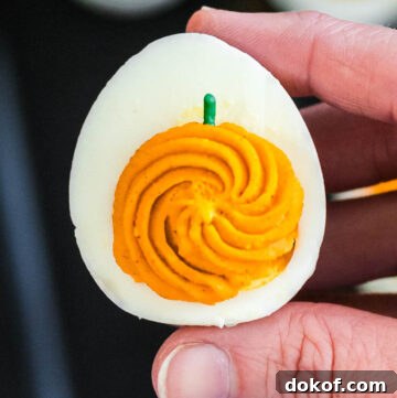 hand holding halloween deviled egg close up