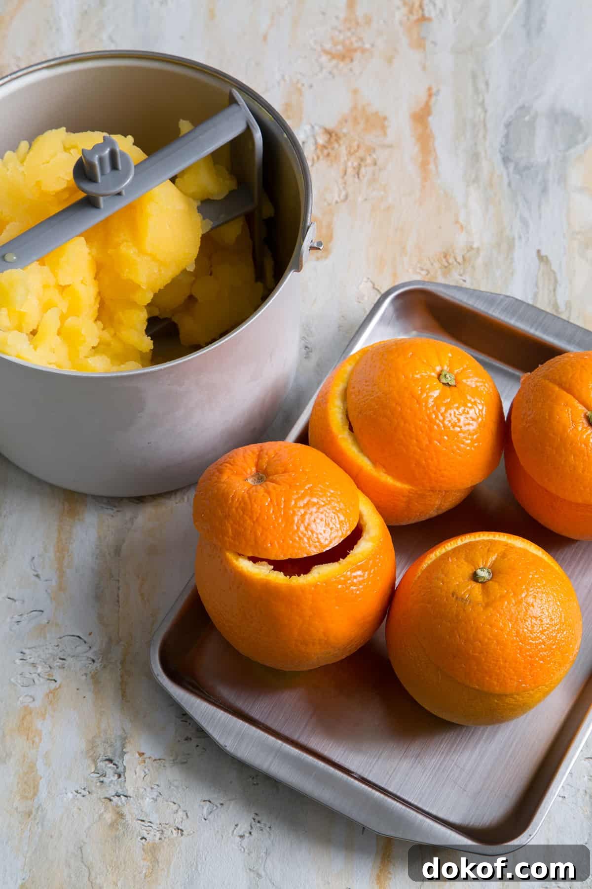 hollowed out oranges to be filled with orange sorbet.