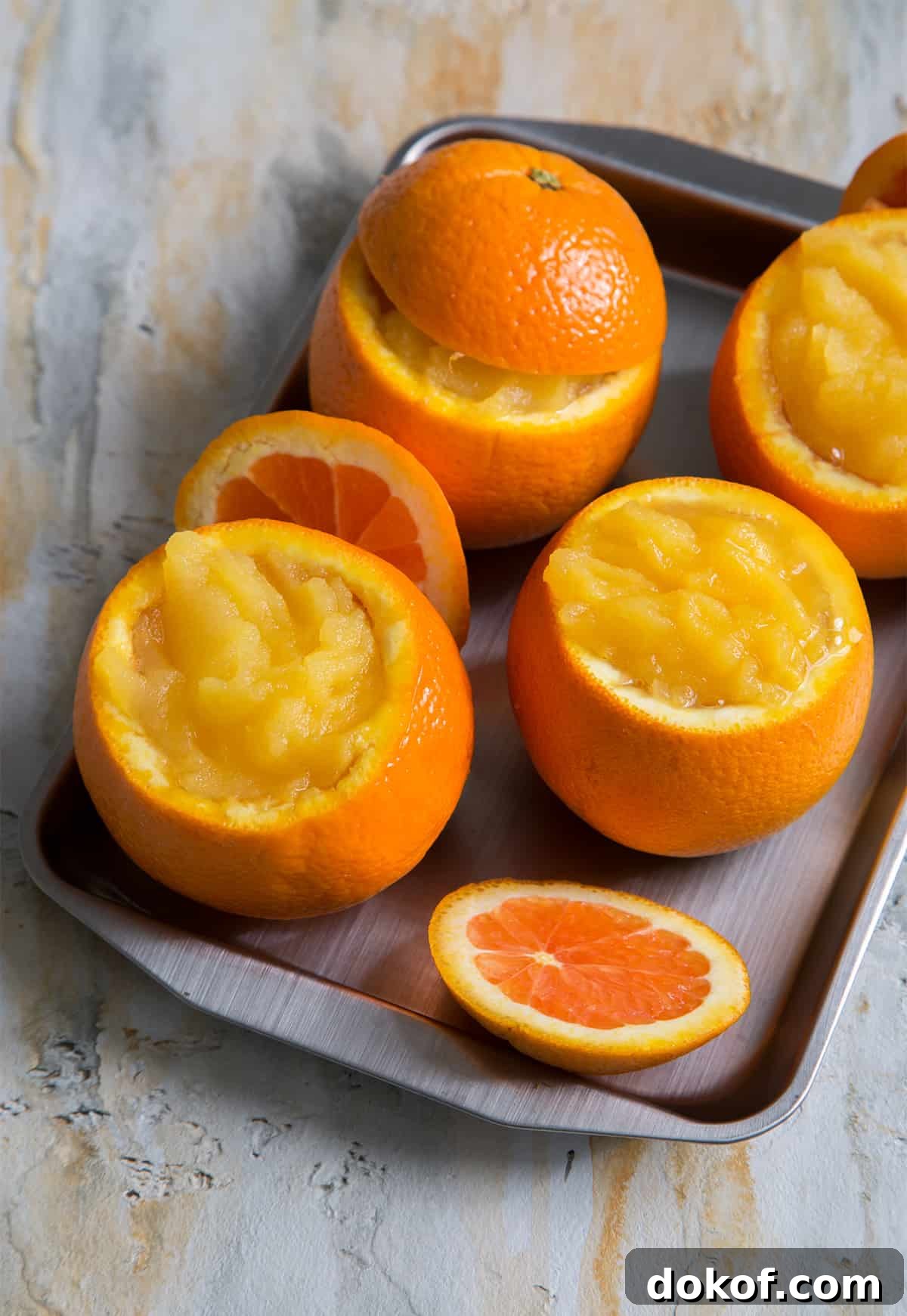 fresh churned orange sorbet in hollowed orange shells.
