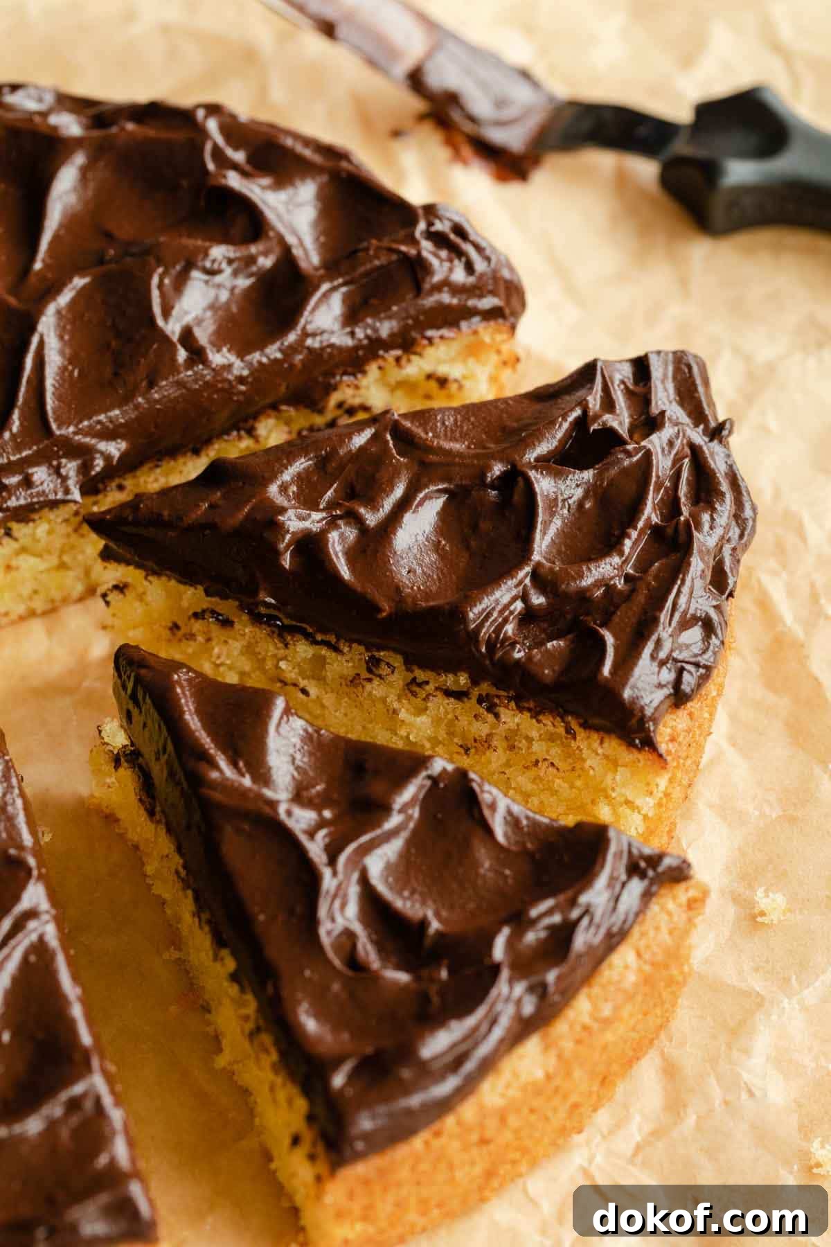 Side view of chocolate avocado frosting on a slices of cake.