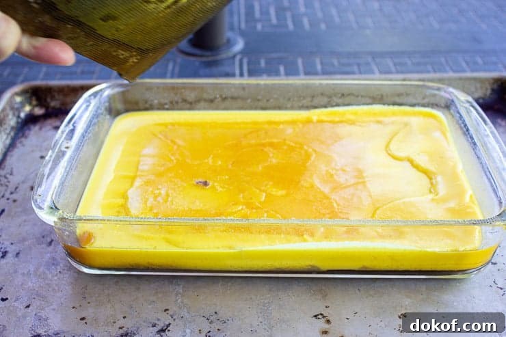 Yellow beeswax in a glass dish. 