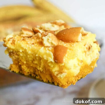 holding a banana pudding brownie on a serving utensil.