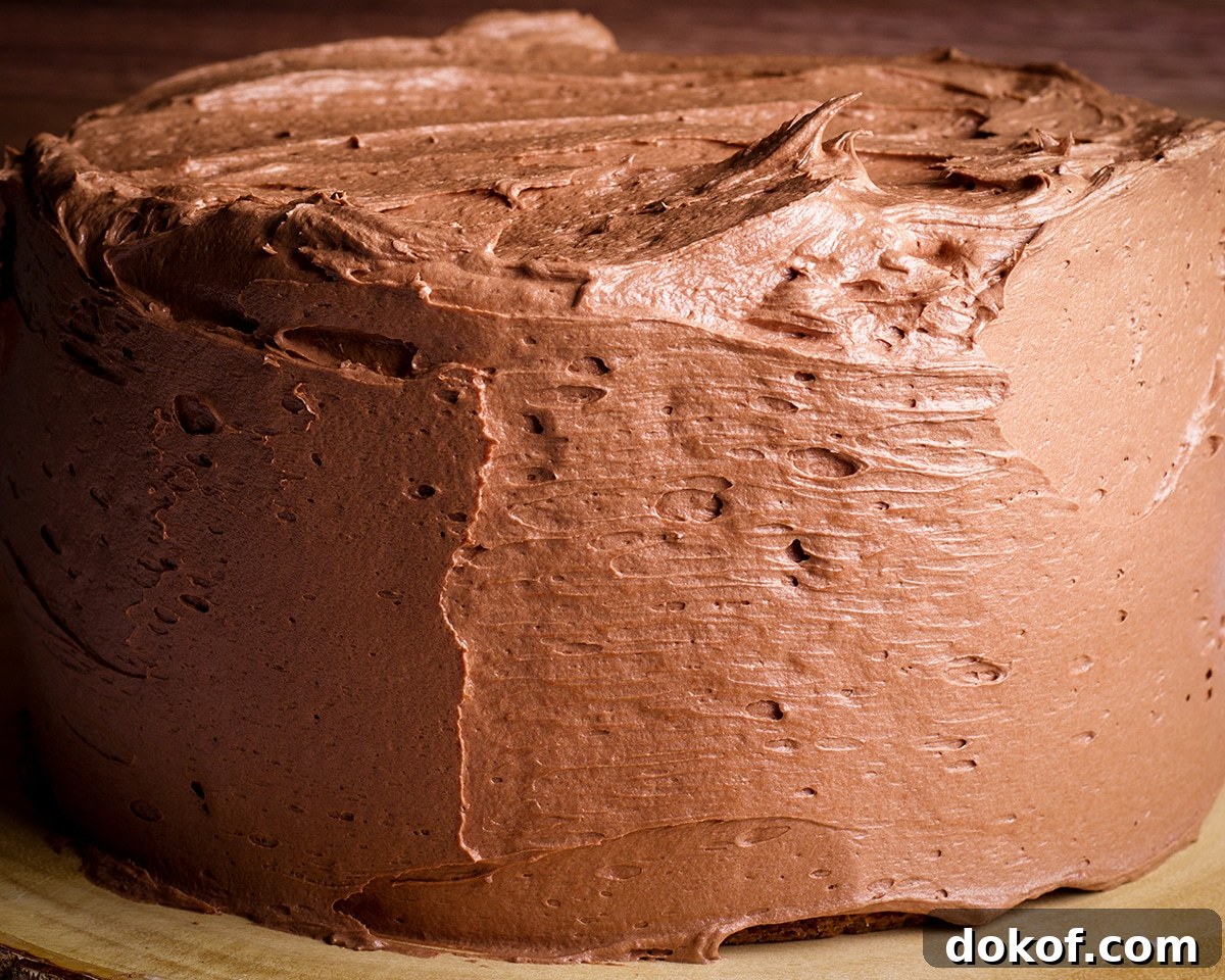 Quick Chocolate Buttercream Made with Heavy Cream 2 A layer cake covered in chocolate buttercream.