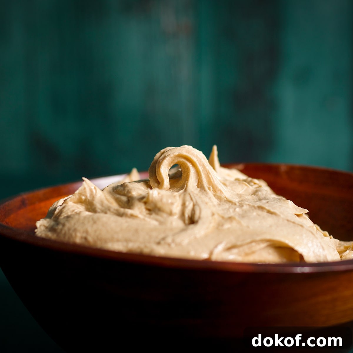 A bowl filled with peanut butter frosting