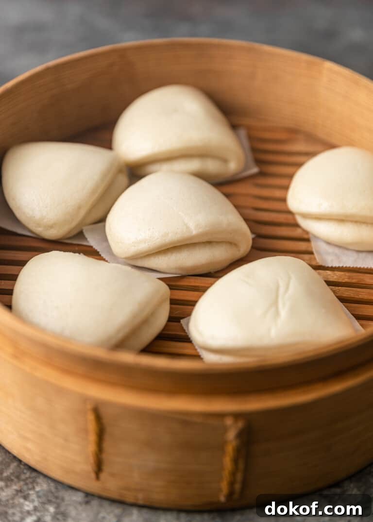 closeup: my steamed bao bun recipe in a wooden steamer