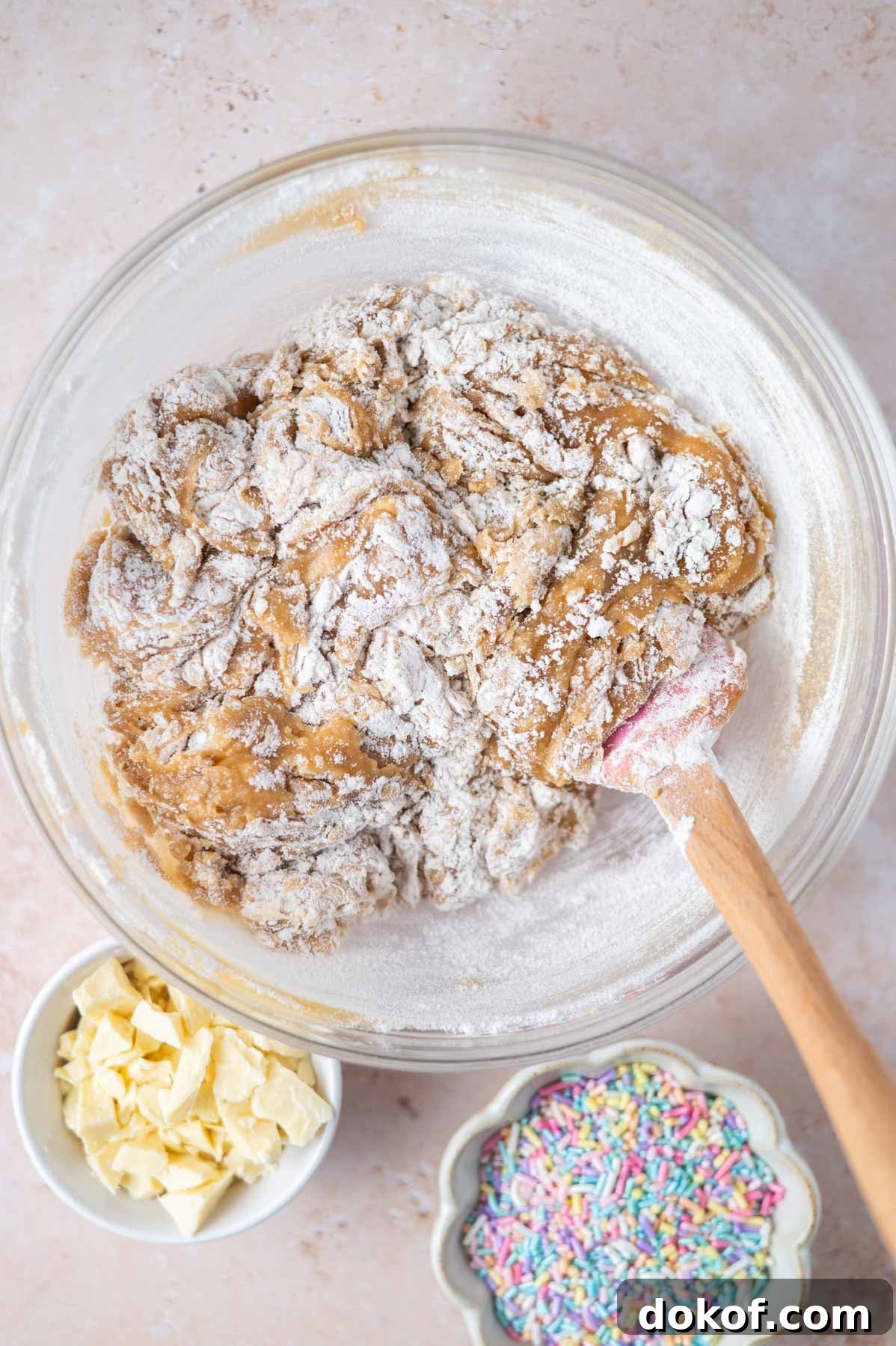 flour mixed into blondie batter with some large streaks of flour remaining