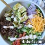 Cheeseburger bowls with ground beef, cheese, and veggies.