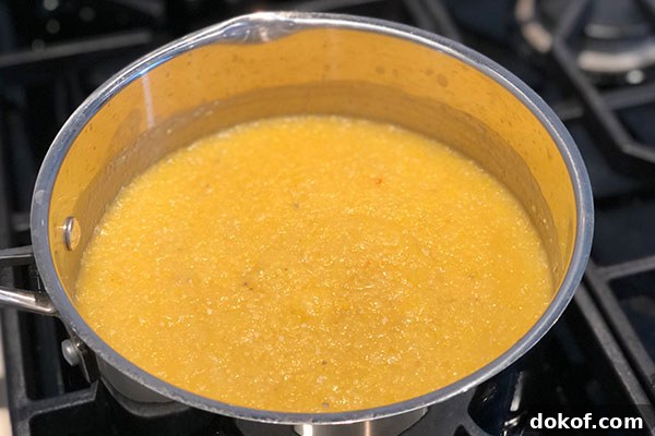 corn polenta cooking in pan
