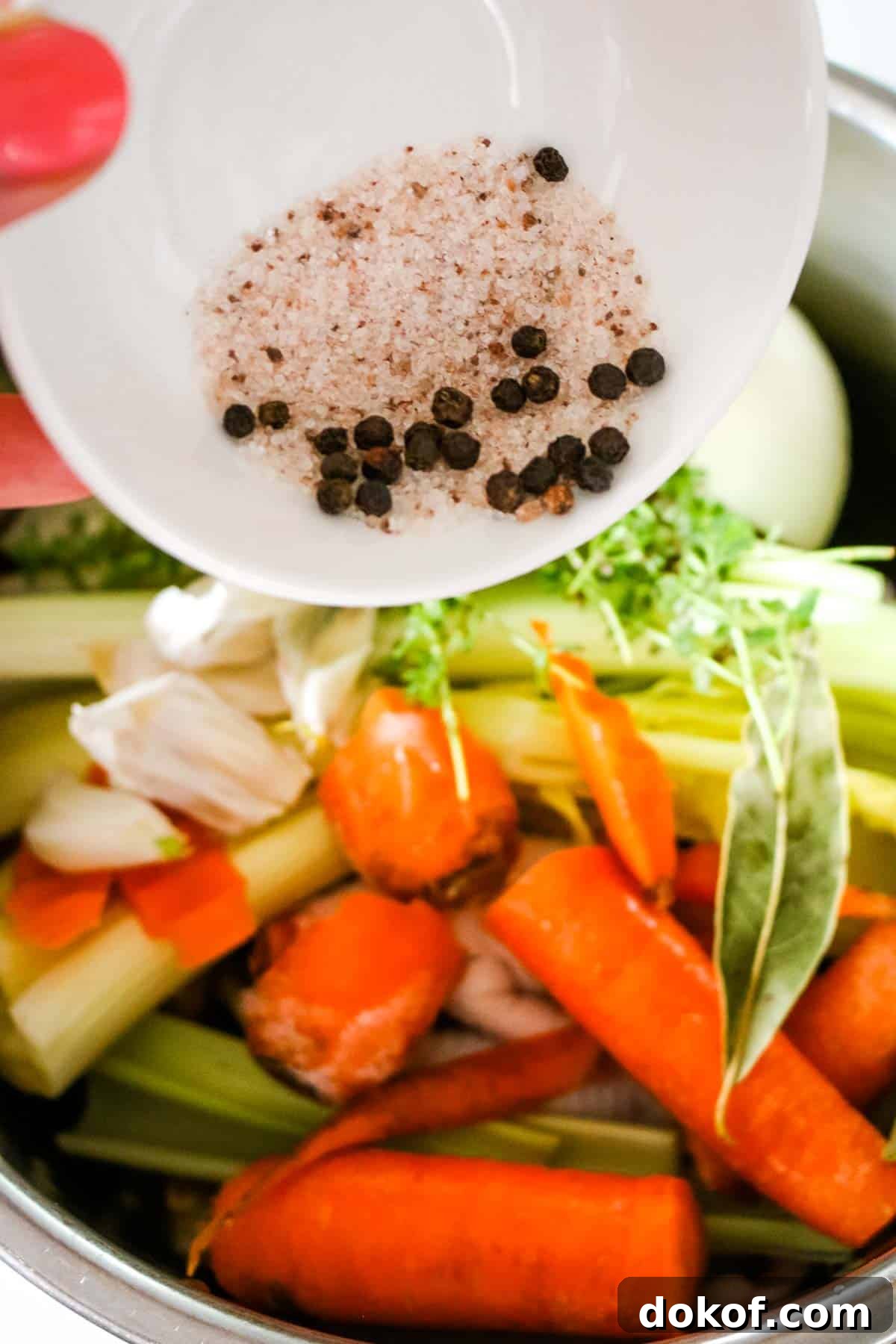 adding all ingredients to instant pot for chicken bone broth.
