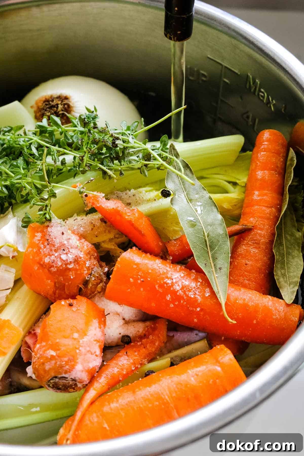 adding water to veggie scraps.
