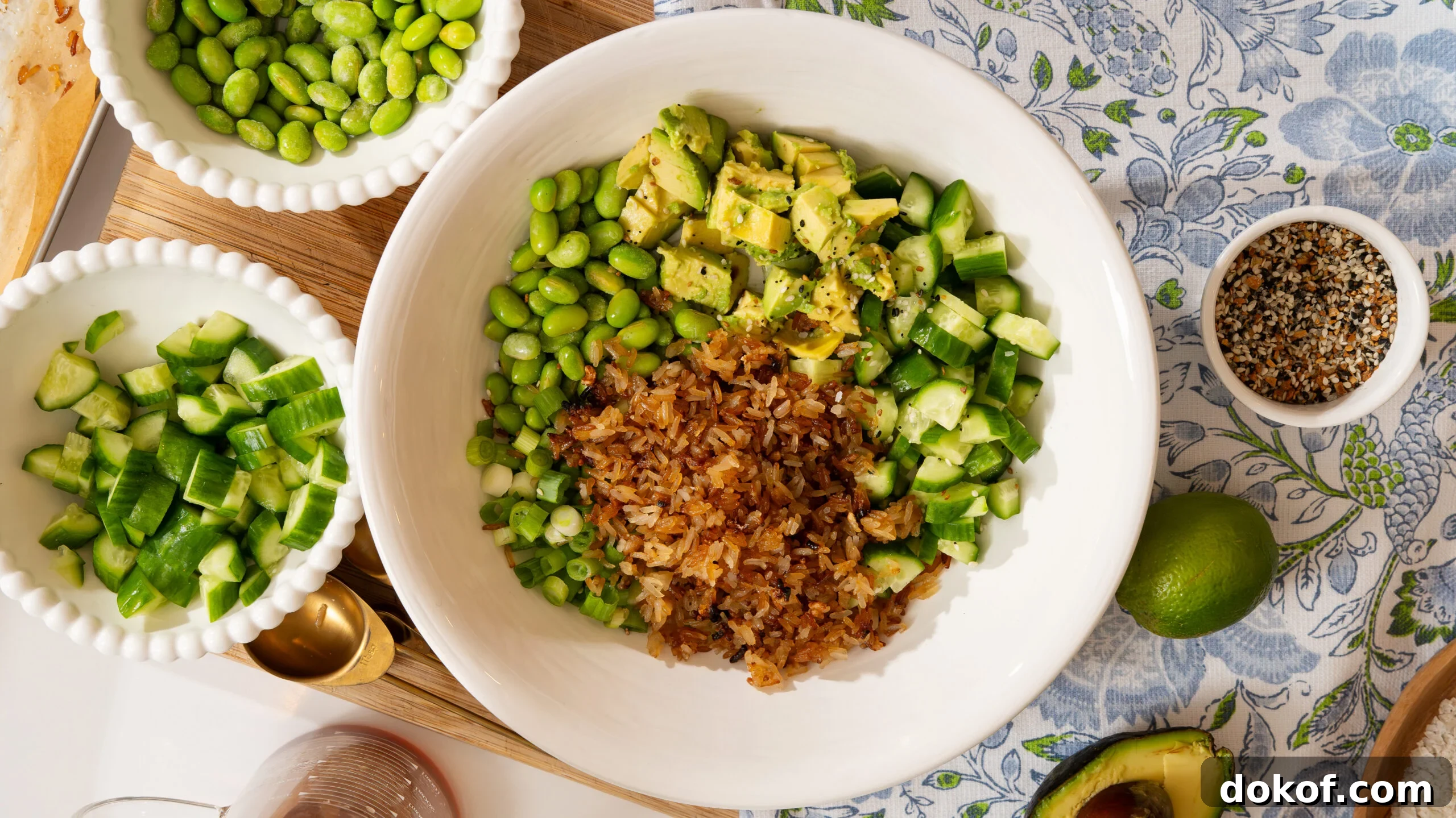 Crispy rice salad ingredients in a white bowl.