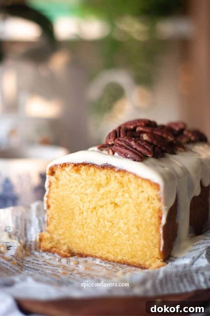 Classic Old-Fashioned Pound Cake Recipe: Step-by-Step Guide 10 sliced pound cake placed on wooden board over a parchment paper
