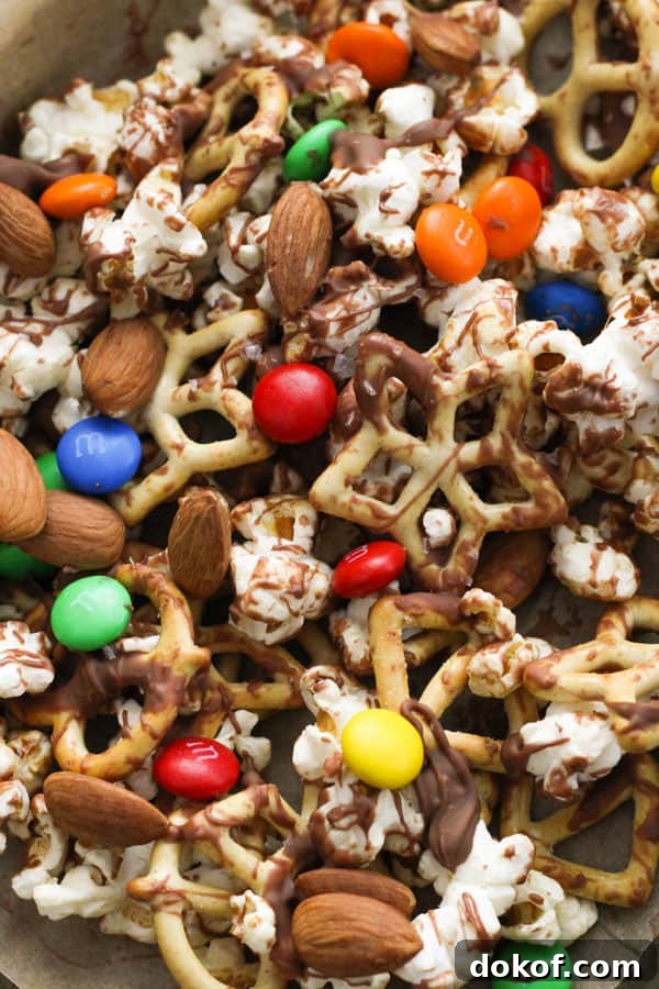 Savory Popcorn Trail Mix Recipe for Road Trips & Snacks 8 popcorn trail mix on a baking tray.