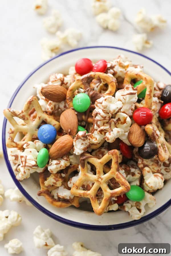 Savory Popcorn Trail Mix Recipe for Road Trips & Snacks 9 popcorn trail mix in a white bowl.