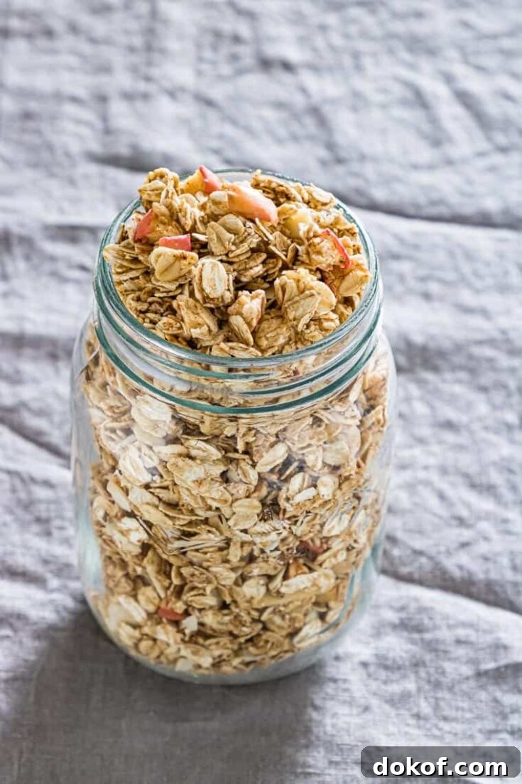 a bottle of apple granola on a table
