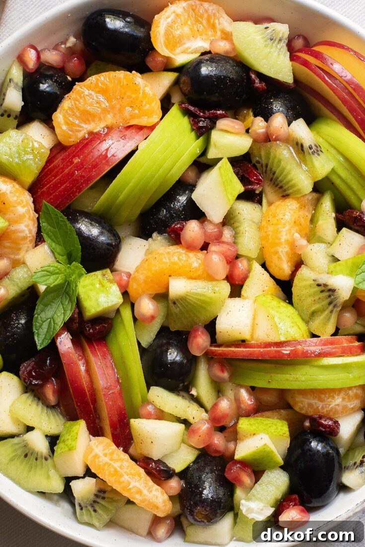 Zoomed in view of sliced fruit in a white bowl.