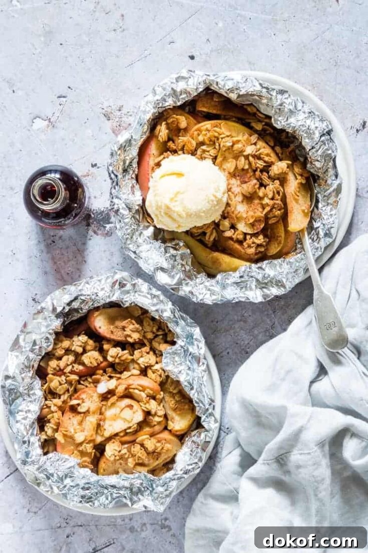 2 bowls of campfire apple crisp foil packets with ice cream