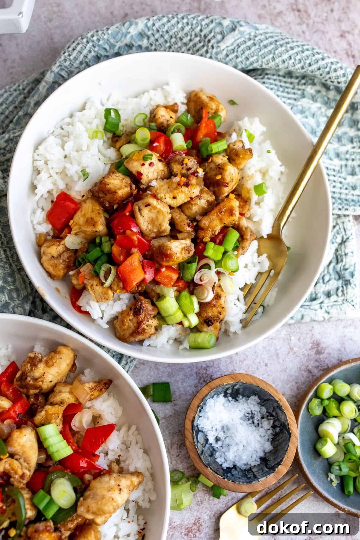 Crispy Chicken with salt and pepper seasonings served over rice with veggies.