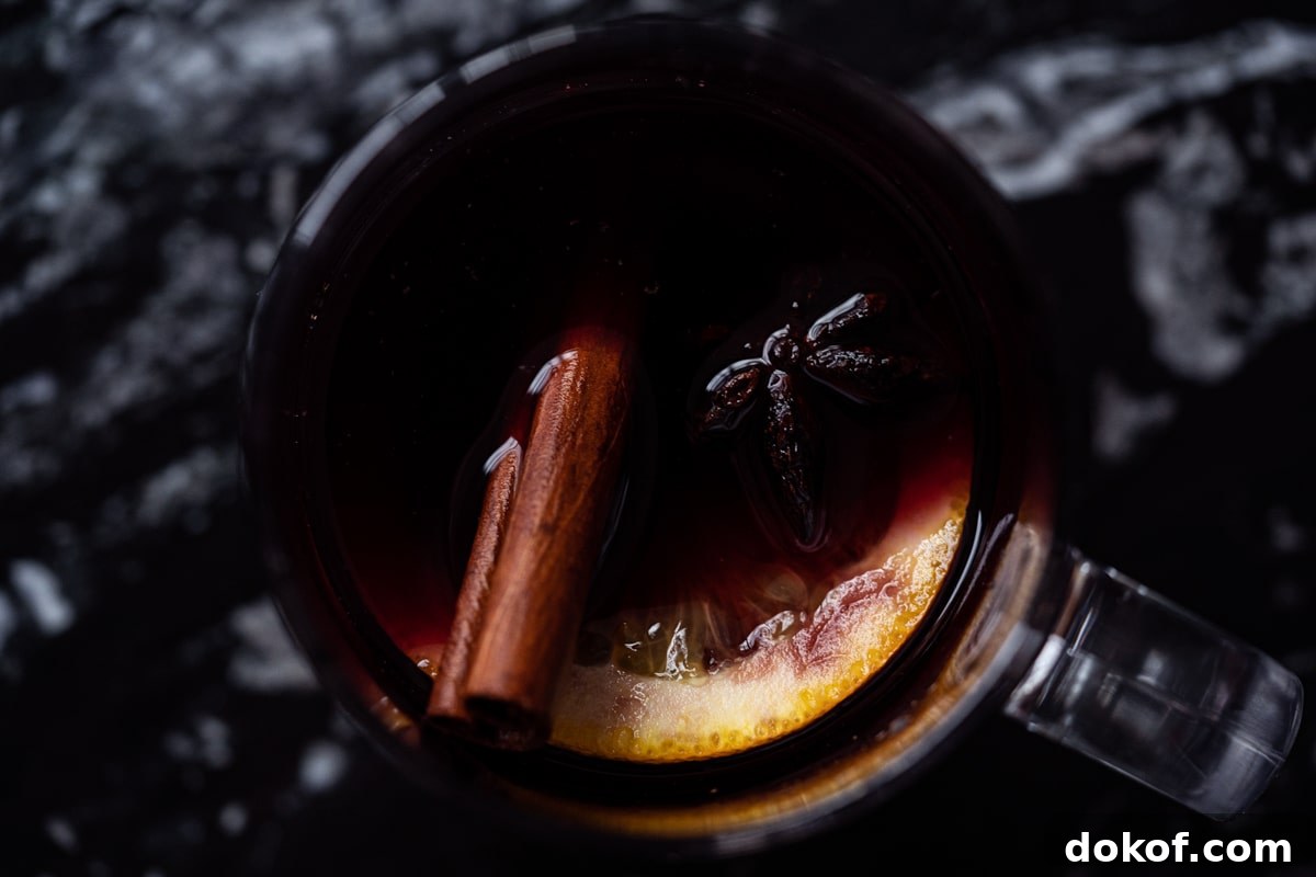 Overhead shot of a mug with keto mulled wine, orange and spices