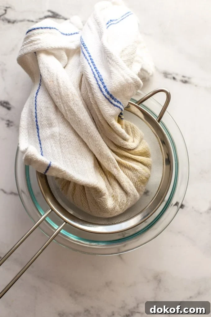 Pour the cashew mixture into the center of a cheesecloth