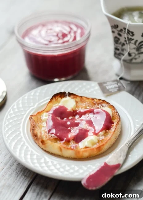 english muffin with butter and raspberry curd