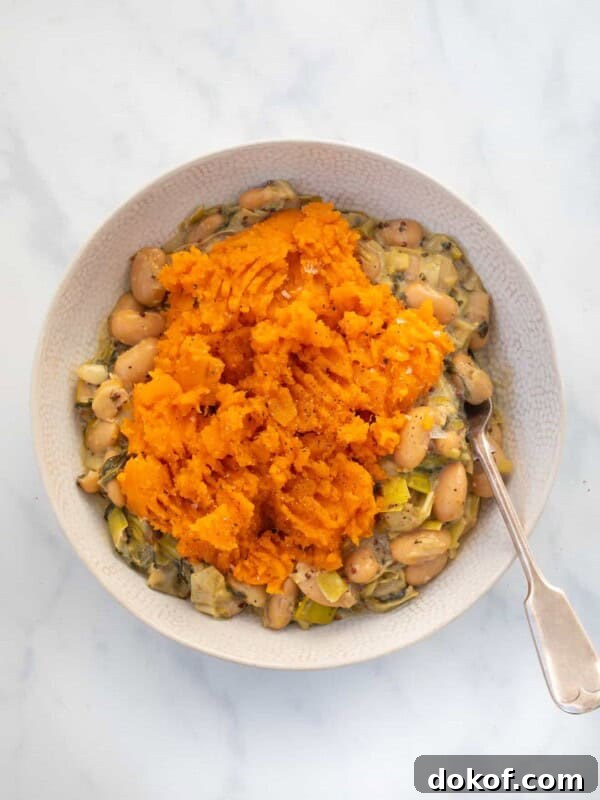 overhead view of Butterbean and Leek Pie topped with sweet potato mash.