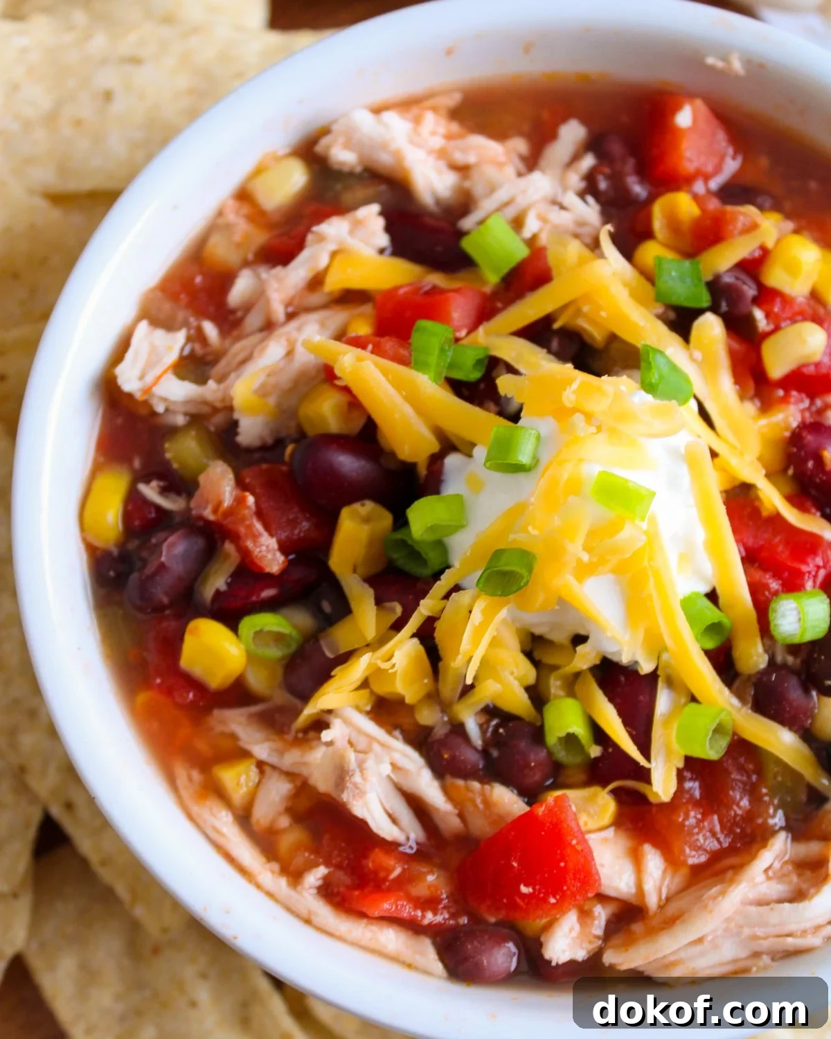Chicken Taco soup garnished with deluxe toppings. 