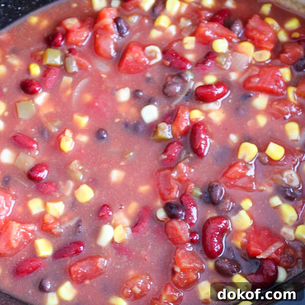 Mixed taco soup ingredients in a crockpot. 