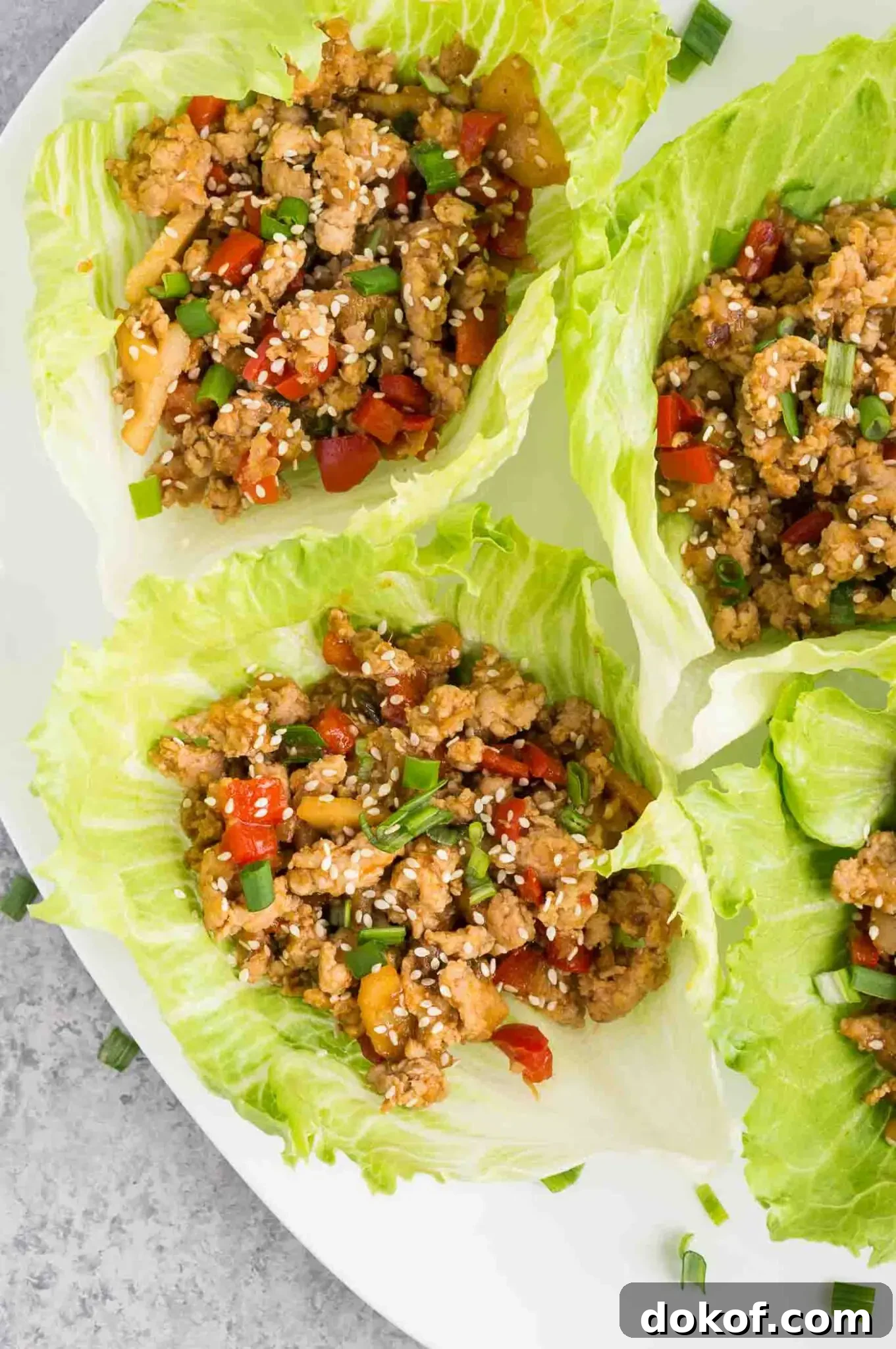 close up image of chicken lettuce wraps on a plate