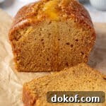Moist Vegan Golden Syrup Cake Recipe with Sticky Glaze 11 Vegan golden syrup cake with one slice removed.