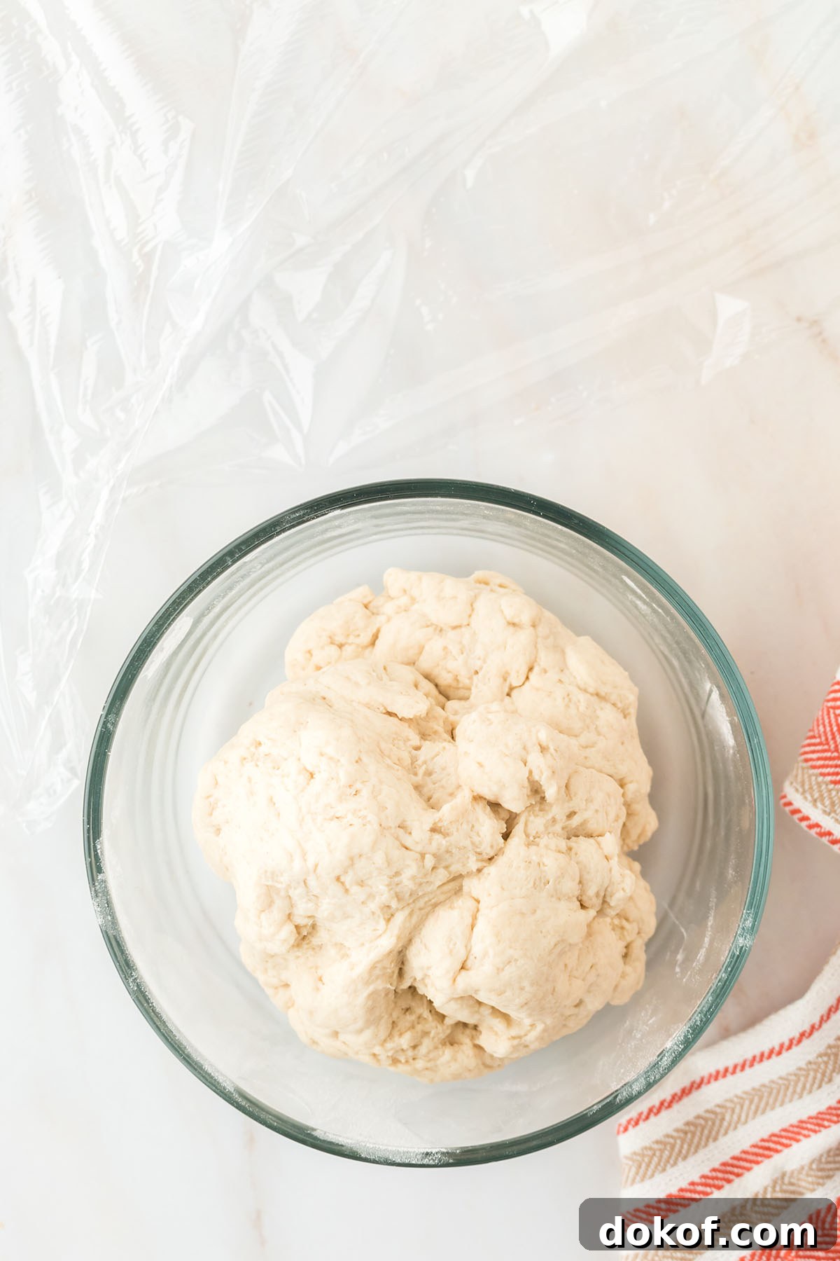 Sopapillas dough in a glass bowl.