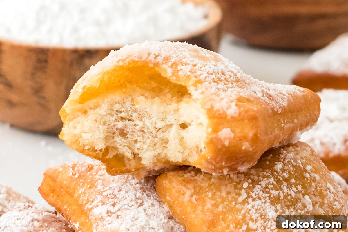 Sopapillas topped with powdered sugar.