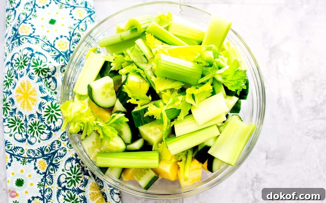 Pineapple Cucumber Rum Punch Recipe for Refreshing Summer Cocktails 3 bowl of fresh fruits and vegetable for the rum punch