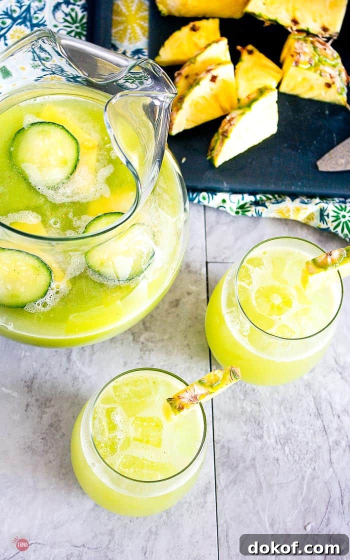 Pineapple Cucumber Rum Punch Recipe for Refreshing Summer Cocktails 5 overhead shot of pitcher of pineapple cucumber rum punch