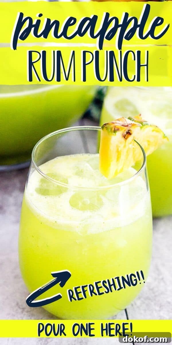 Pineapple Cucumber Rum Punch Recipe for Refreshing Summer Cocktails 7 pineapple punch in wine glass with pineapple garnish with text "pineapple rum punch"