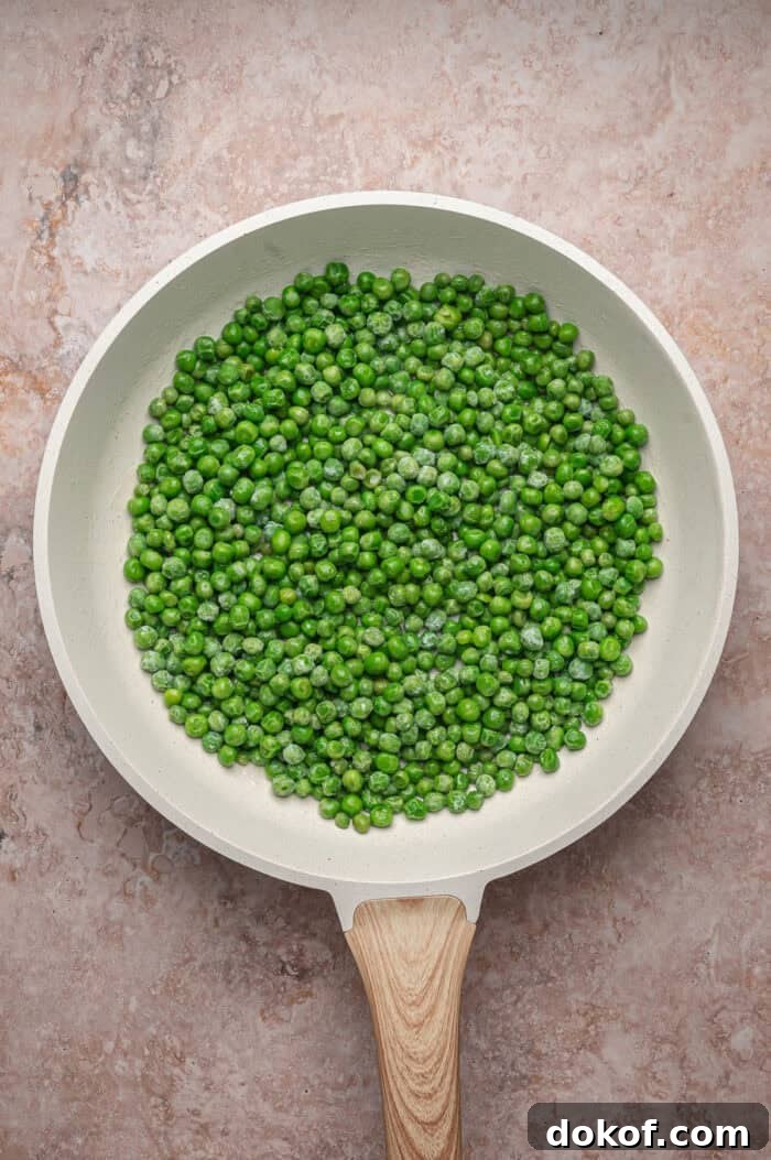 Peas and butter in a skillet