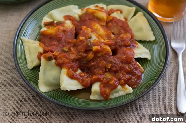 Easy school night recipe-Spinach Ravioli with a Garden Vegetable Pasta sauce recipe via flouronmyface.com