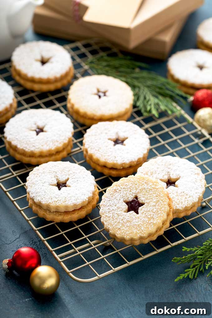 Classic Linzer Cookies Recipe: How to Make Austrian Jam Sandwich Cookies 2 eight linzer cookies over a cooling rack