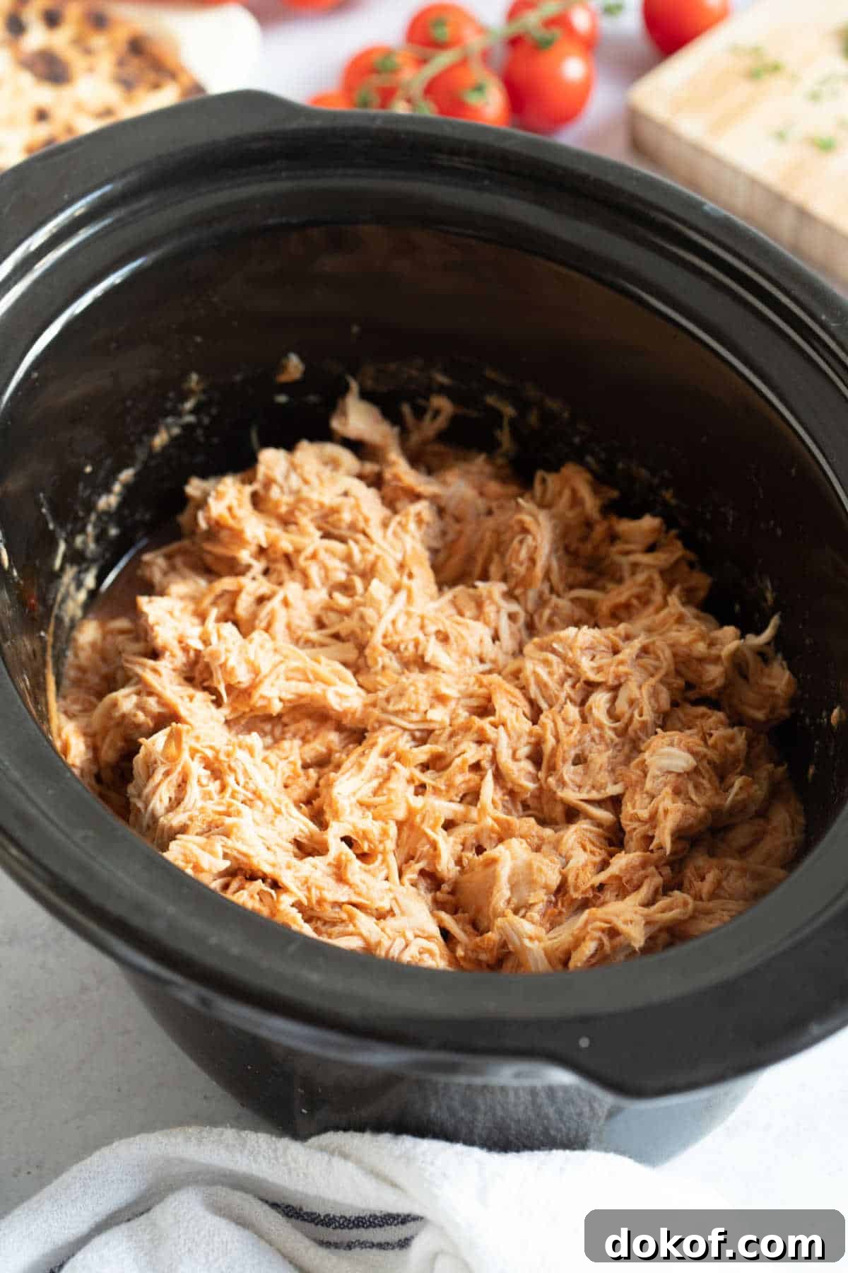 Slow cooker BBQ pulled chicken in a crockpot.