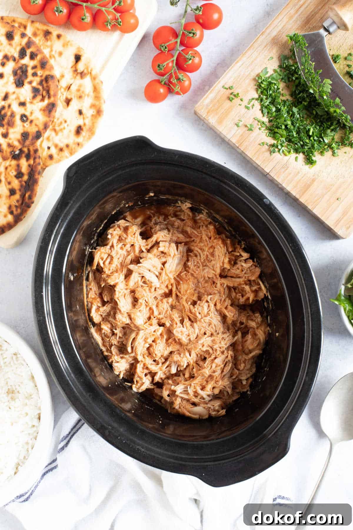 BBQ pulled chicken in a slow cooker.