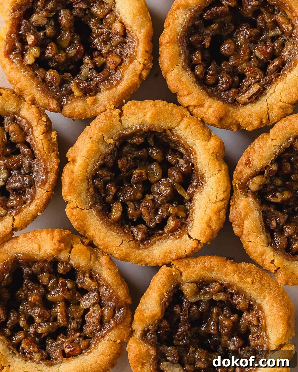 Pecan pie cookies: buttered brown sugar cookie cups with pecan pie filling.