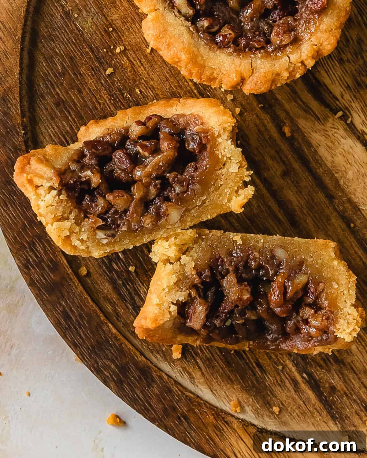 Finished pecan pie cookies: soft cookie cups filled with pecan pie filling.