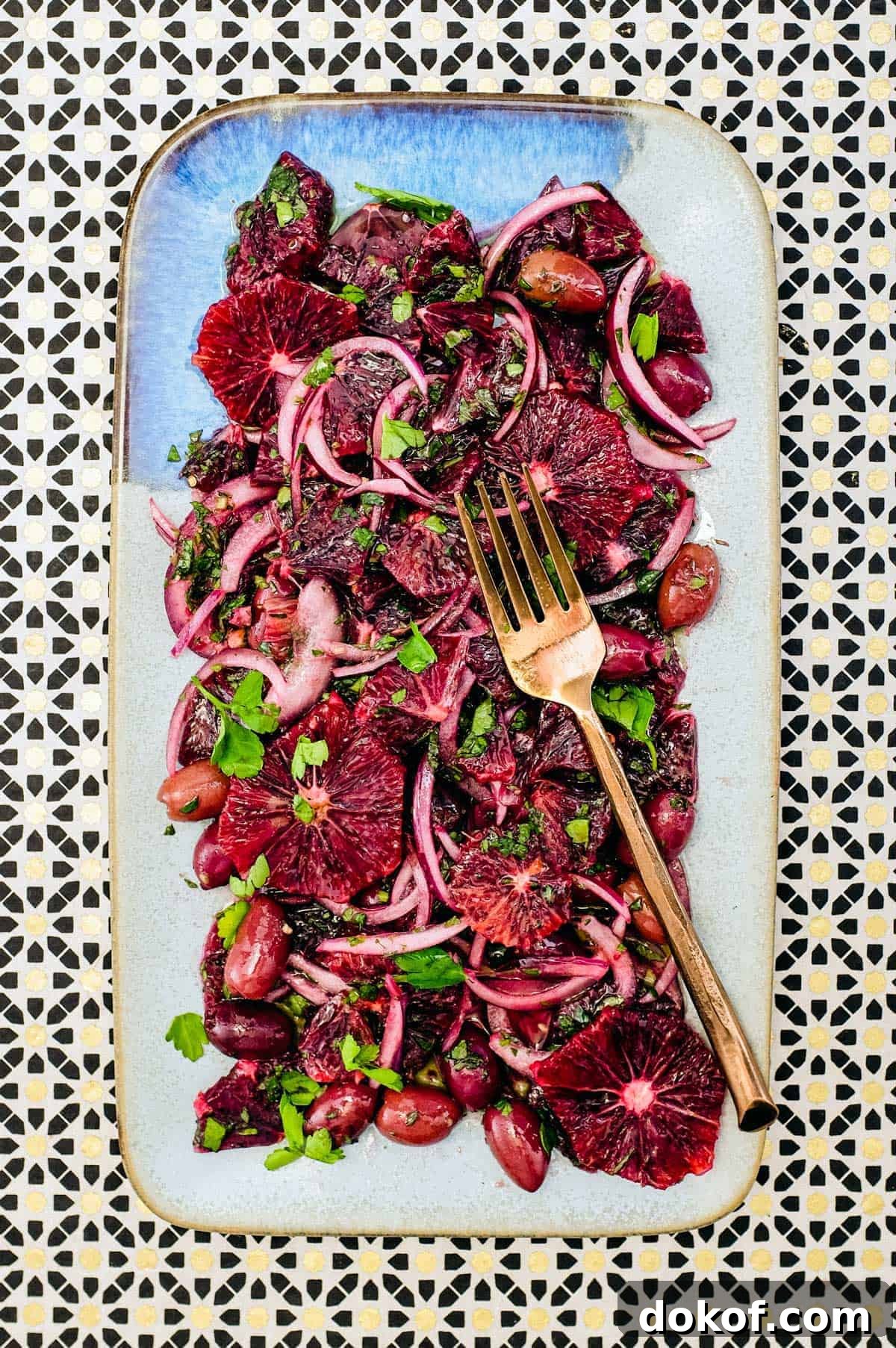 Moroccan Blood Orange Salad | cookeatworld.com A platter of blood orange salad with black olives, onion and herbs