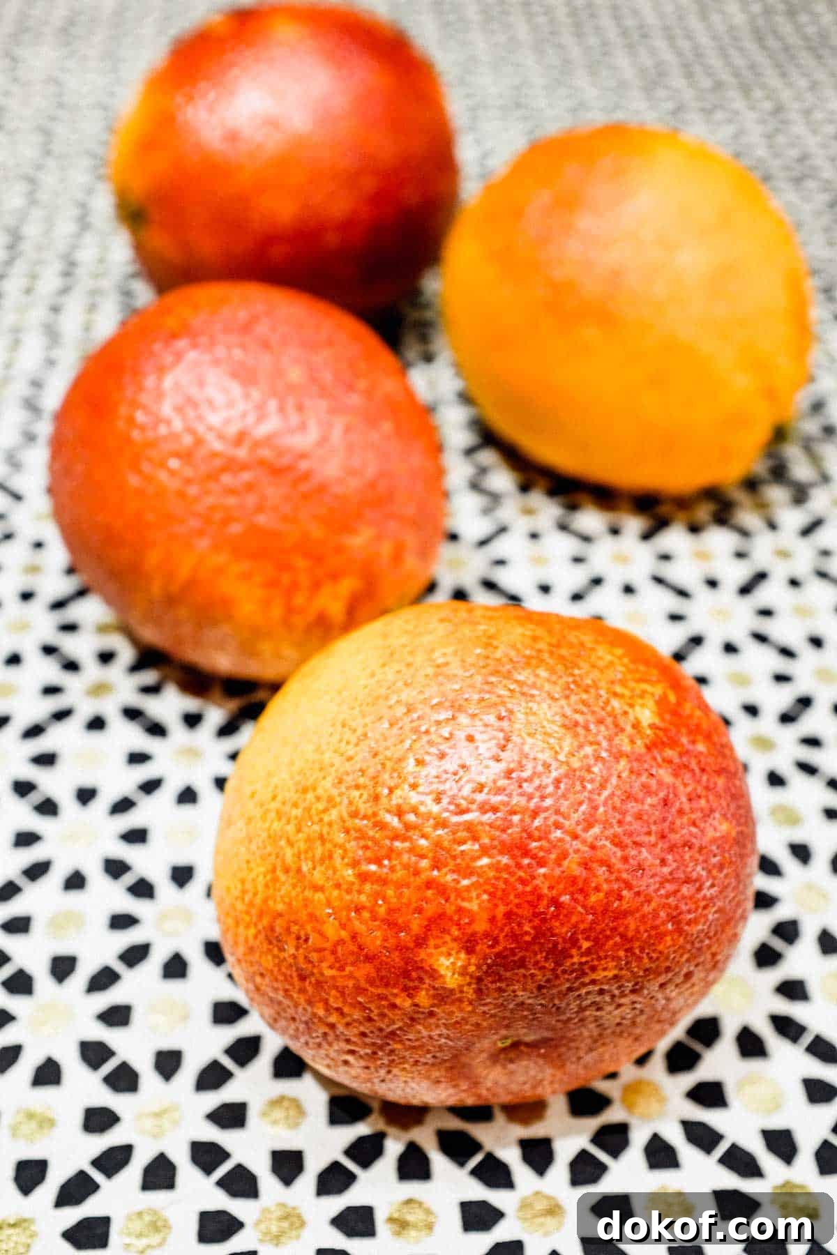 Moroccan Blood Orange Salad | cookeatworld.com Three blood oranges on a patterned surface