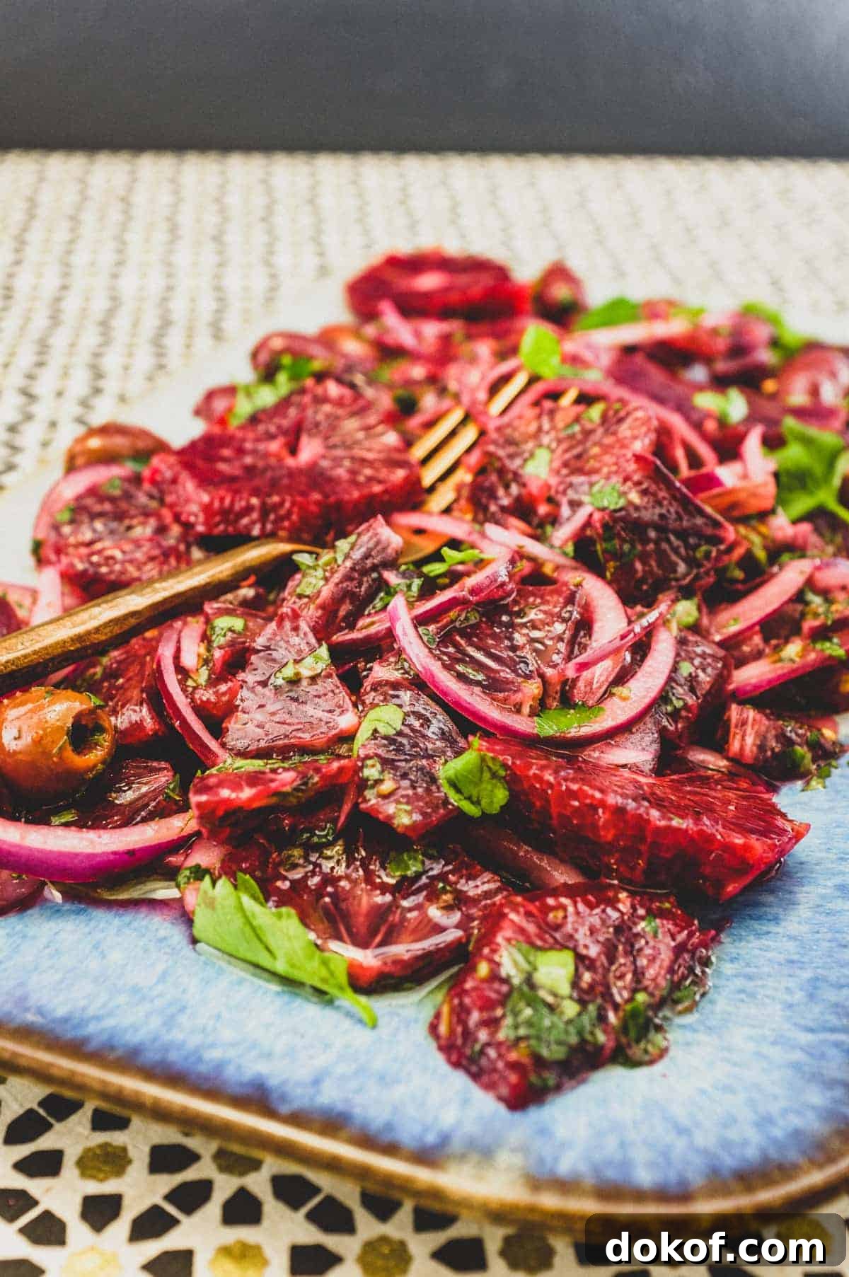 Moroccan Blood Orange Salad | cookeatworld.com A platter of blood orange salad with black olives, onion and herbs