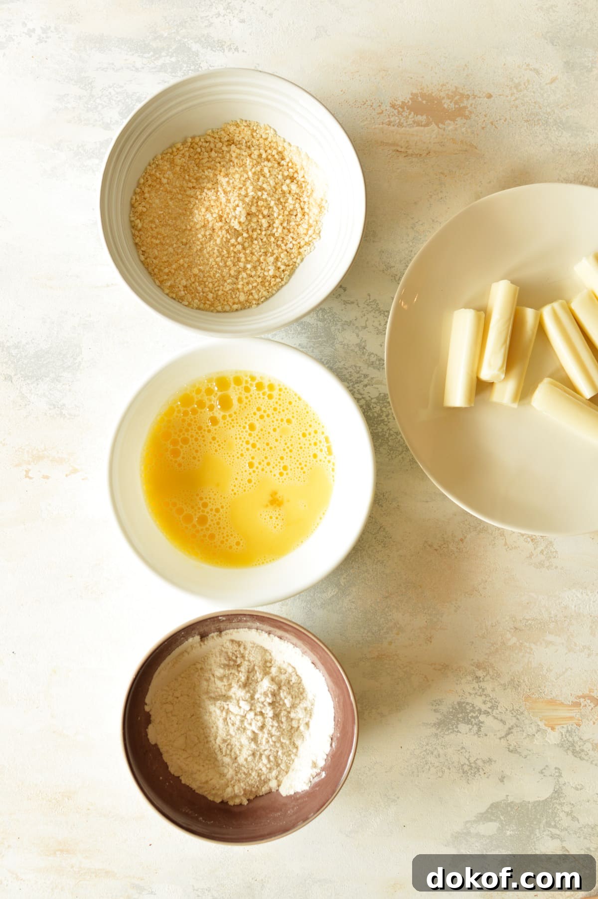 bowls of gluten free flour, eggs, and breadcrumbs